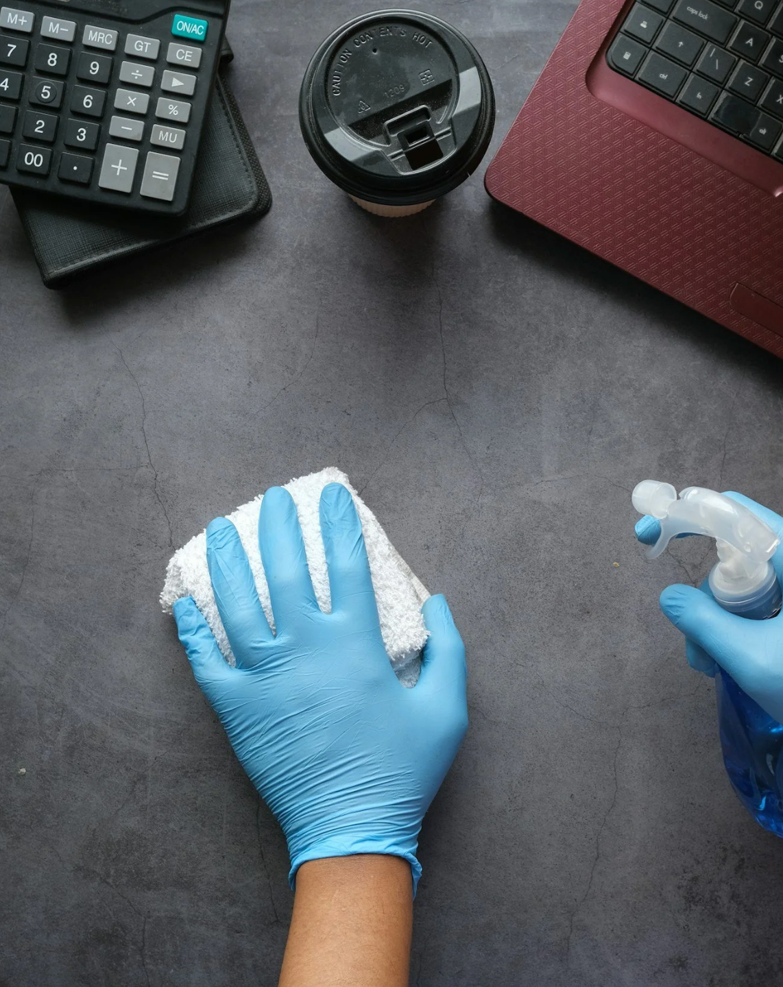 Eco Clean Pro team member cleaning a surface with eco-friendly products